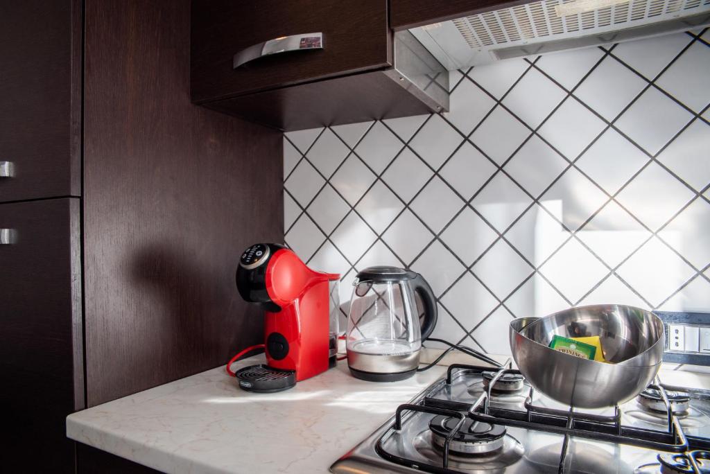 A kitchen or kitchenette at Ami House Roma