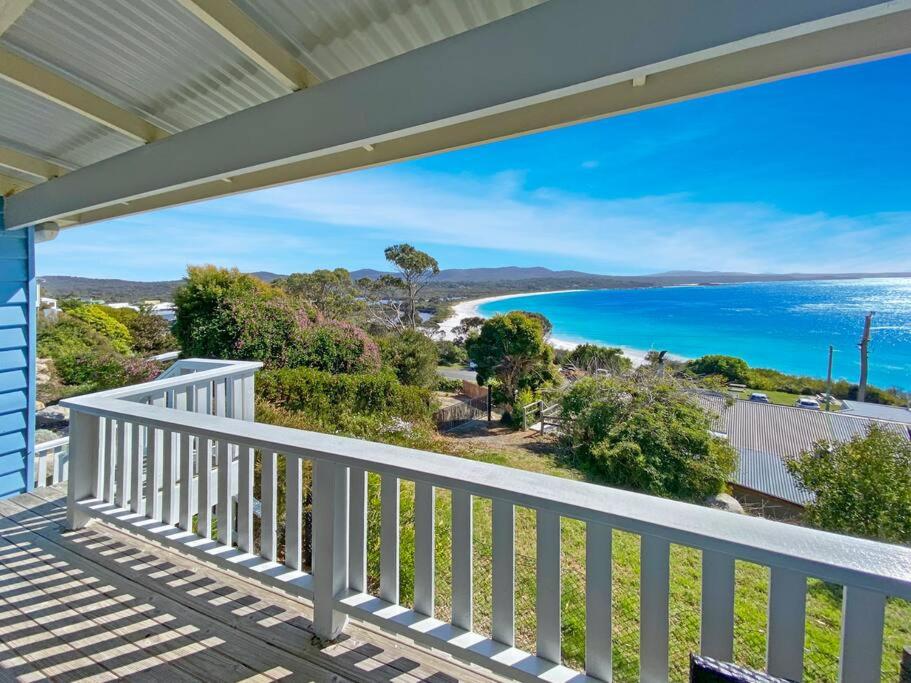 a balcony with a view of the ocean at Bella Costa - Bay of Fires Beach House in Binalong Bay