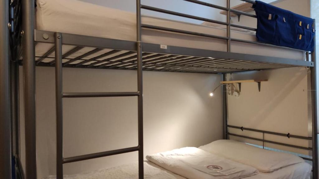 Postel nebo postele na pokoji v ubytování ABAI Apartments 1150 only WWW-On-line-Check-in & SelfService