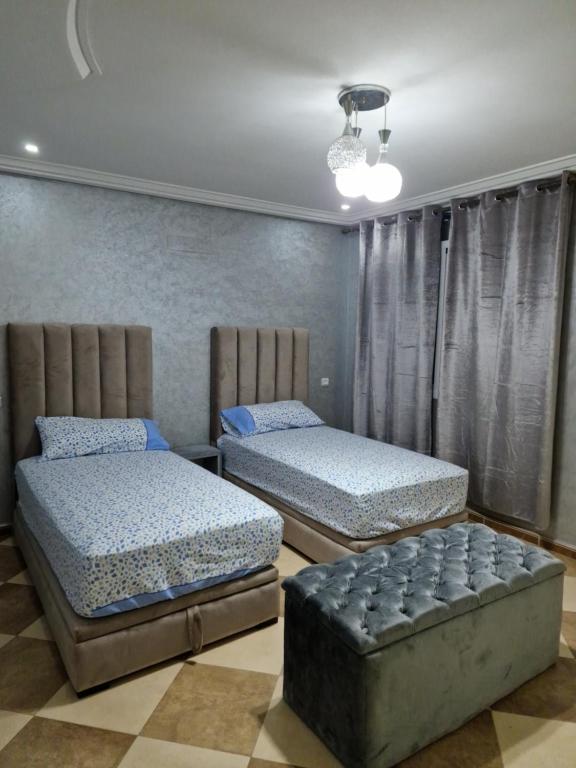 Ένα ή περισσότερα κρεβάτια σε δωμάτιο στο RESIDENCE LA CORNICH