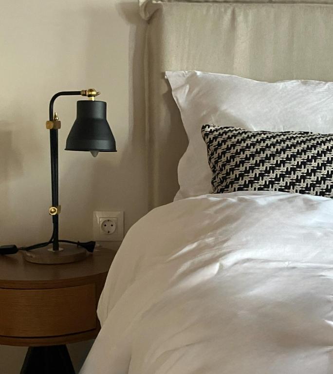 Postel nebo postele na pokoji v ubytování Melofegaro Guesthouse