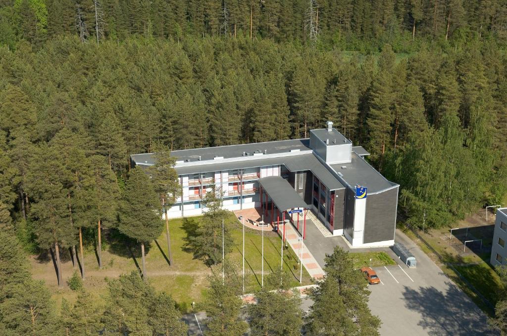 an aerial view of a house in the woods at Hotel Uusikuu in Mikkeli