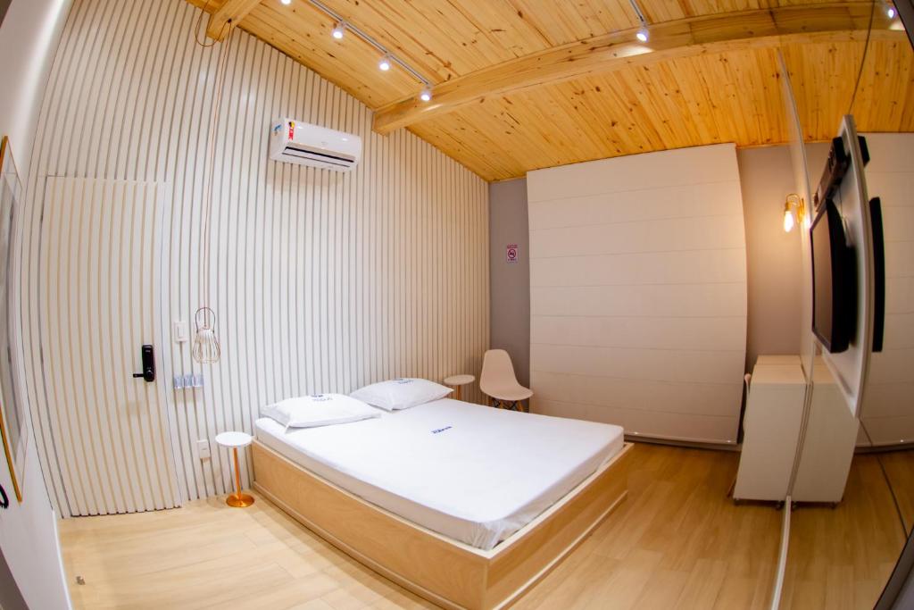 Postel nebo postele na pokoji v ubytování Motel Itapuã I Fx Nova Camobi