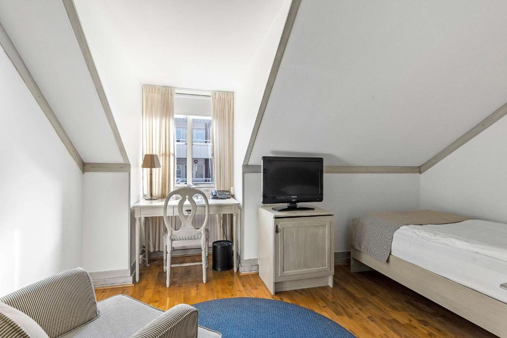 Postel nebo postele na pokoji v ubytování Best Western Plus Edward Hotel
