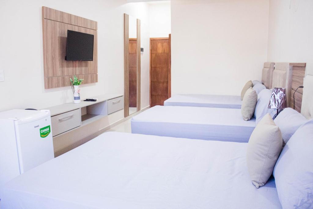 Postel nebo postele na pokoji v ubytování Liebling Hotel Ciudad del Este