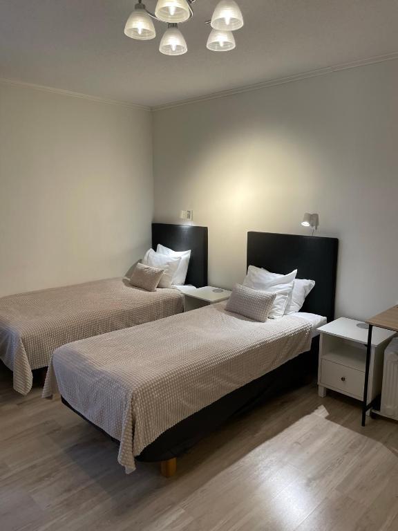 Postel nebo postele na pokoji v ubytování Lapin Satu