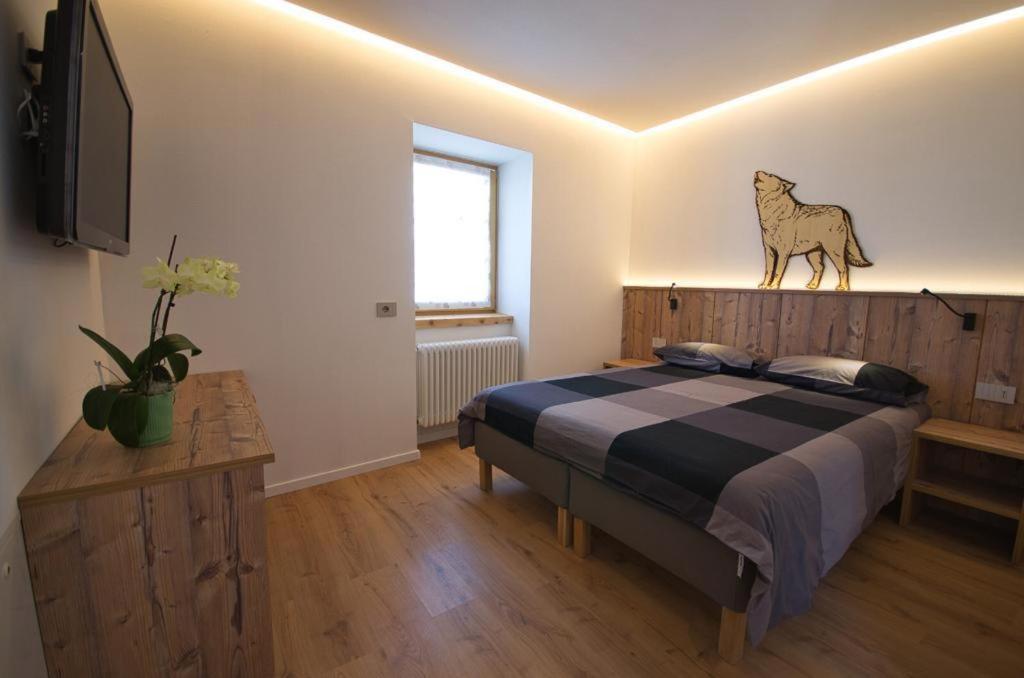 Posteľ alebo postele v izbe v ubytovaní B&B Paganella Relax and Gourmet