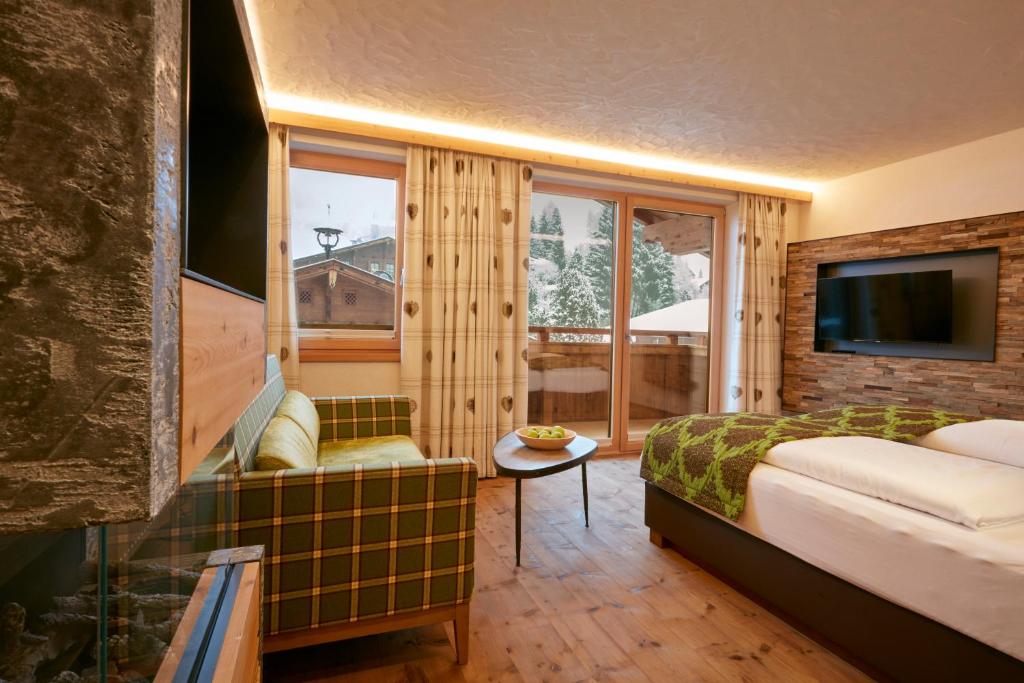 Postel nebo postele na pokoji v ubytování Alpbacherhof Mountain & Spa Resort
