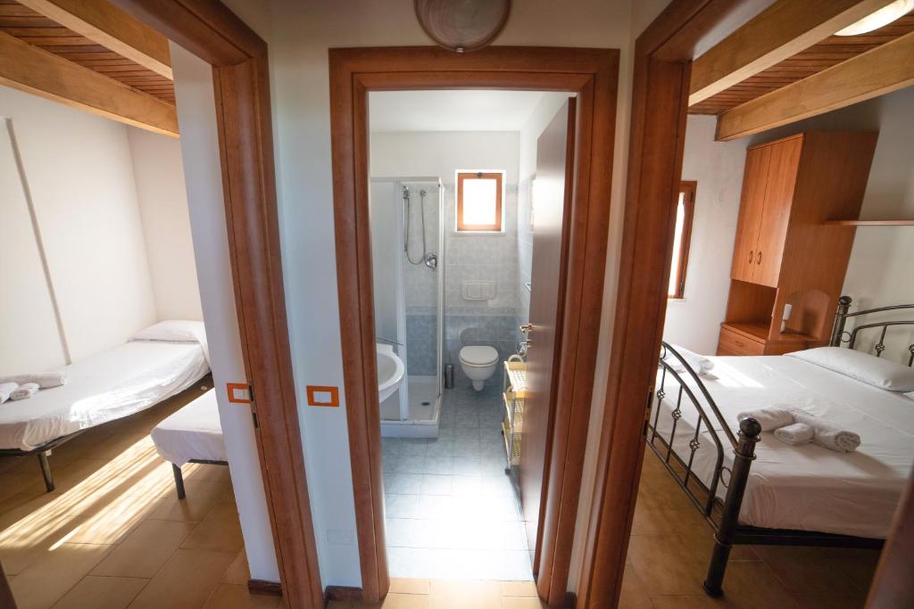 A bed or beds in a room at Residence New Paradise