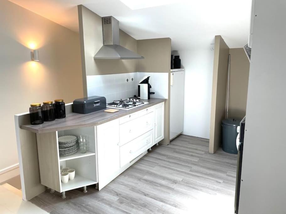 Kuchyň nebo kuchyňský kout v ubytování Cosy Camon Bolt-Hole