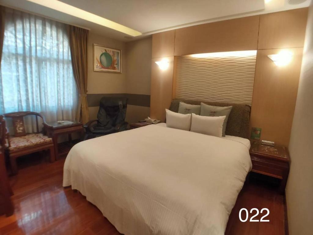 Postel nebo postele na pokoji v ubytování Wunsin Motel
