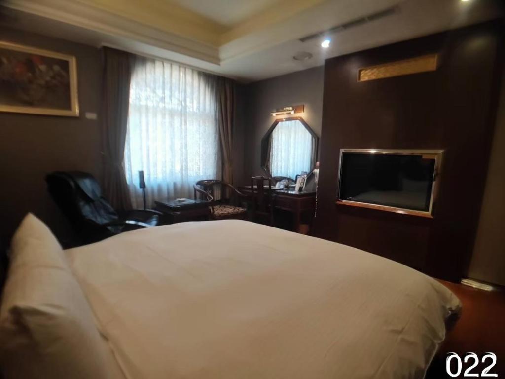 TV a/nebo společenská místnost v ubytování Wunsin Motel