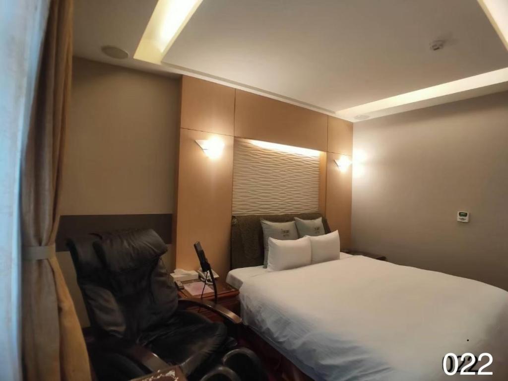 Postel nebo postele na pokoji v ubytování Wunsin Motel