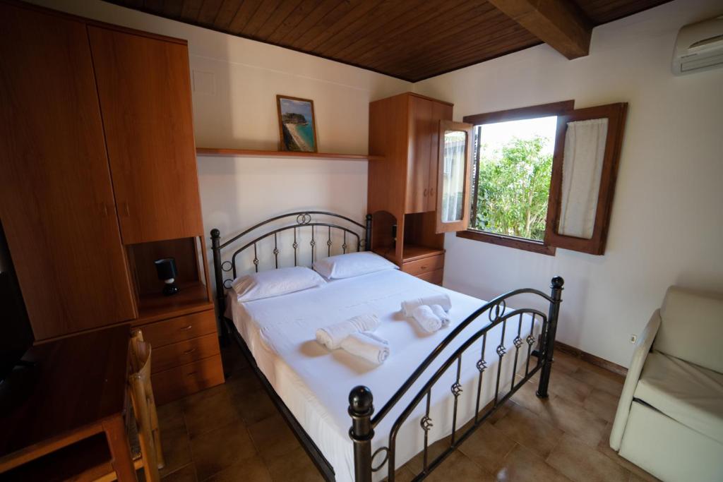 A bed or beds in a room at Residence New Paradise