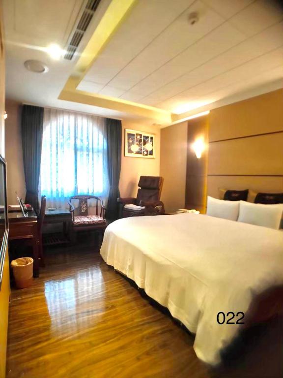 Postel nebo postele na pokoji v ubytování Wunsin Motel