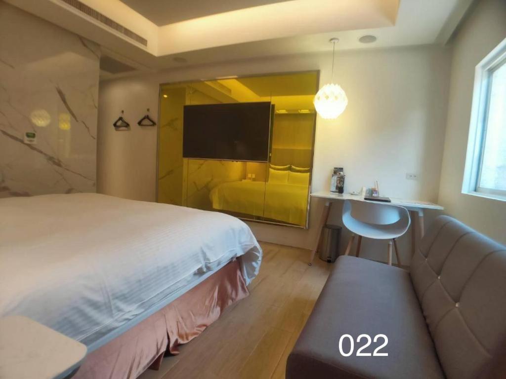Postel nebo postele na pokoji v ubytování Wunsin Motel
