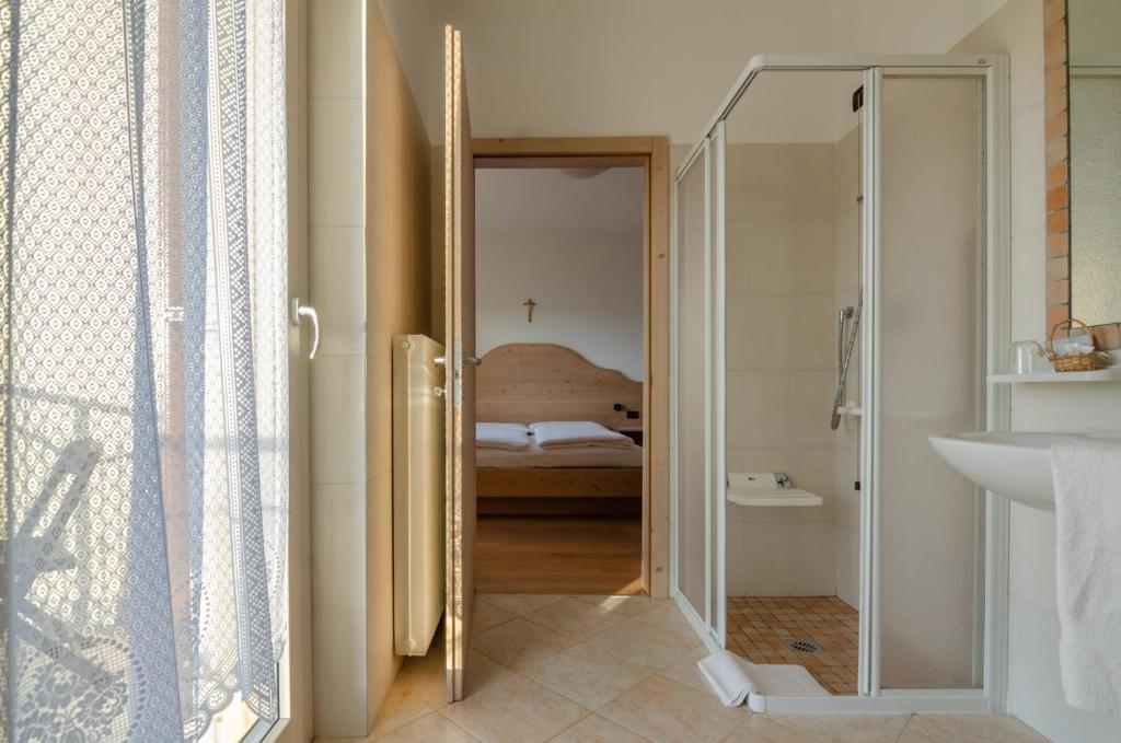 Postel nebo postele na pokoji v ubytování Agritur Cristina