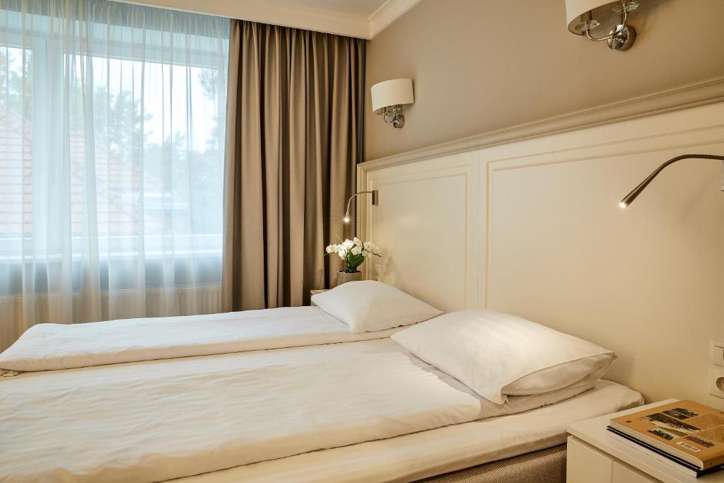 Postel nebo postele na pokoji v ubytování Ratonda Centrum Hotels