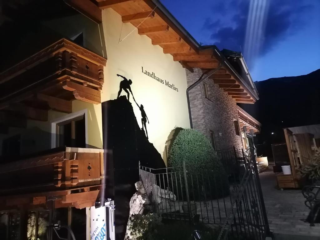 a mural of a man on the side of a building at Landhaus Marlies in Zell am See