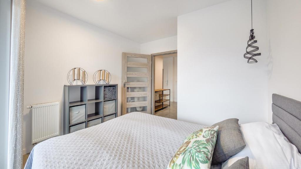 Posteľ alebo postele v izbe v ubytovaní Apartament Grey 10 C Perłowa Przystań - Holiday City
