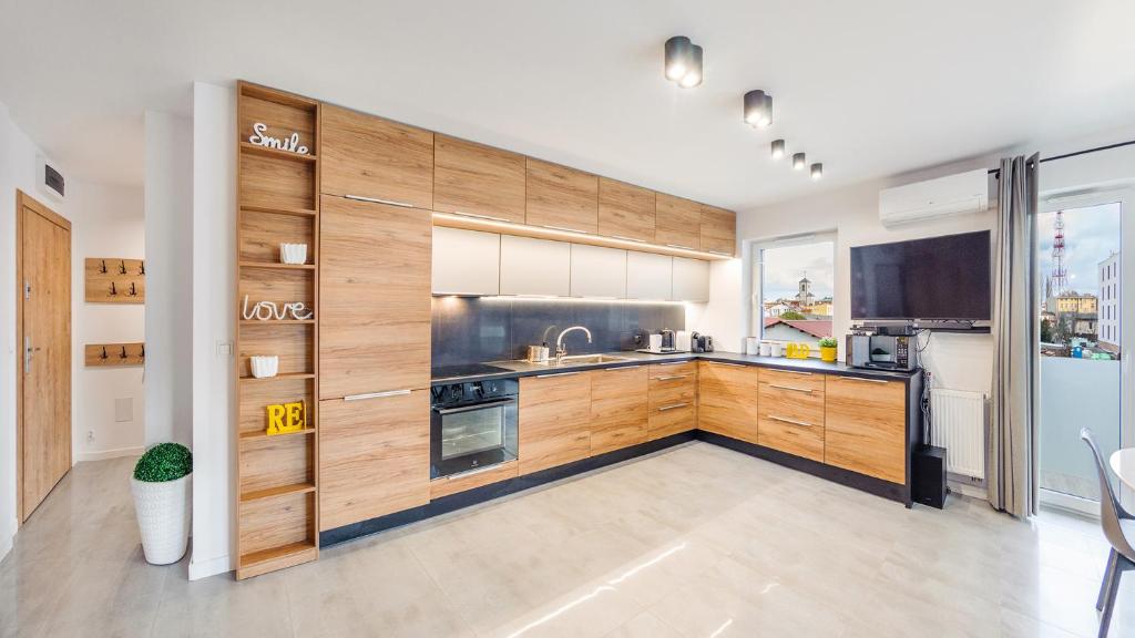 Kuchyňa alebo kuchynka v ubytovaní Apartament Grey 10 C Perłowa Przystań - Holiday City