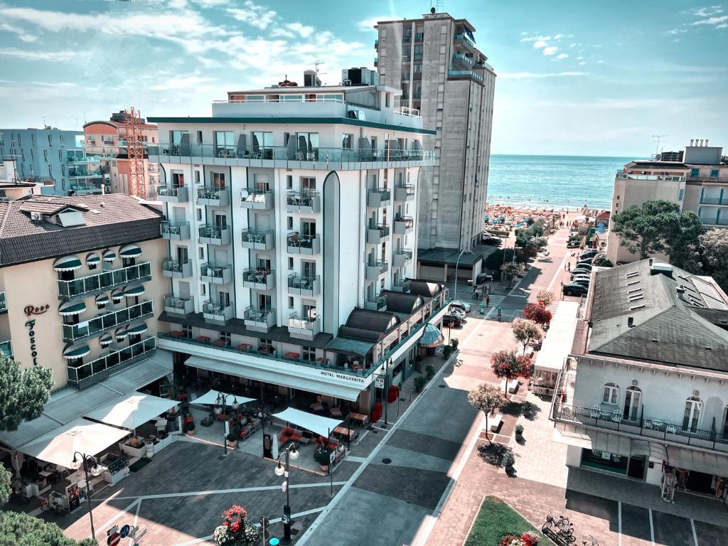 an aerial view of a city street with buildings and the ocean at Hotel Margherita in Lido di Jesolo