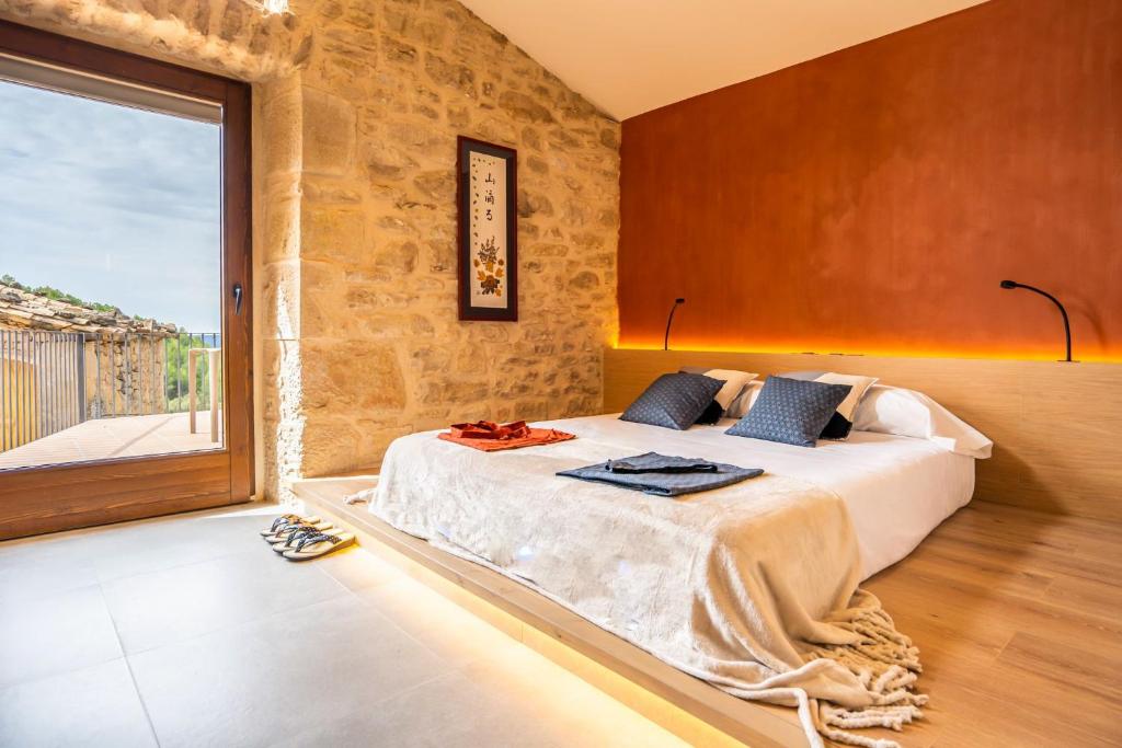 Postel nebo postele na pokoji v ubytování Hotel japonès Puigpinós