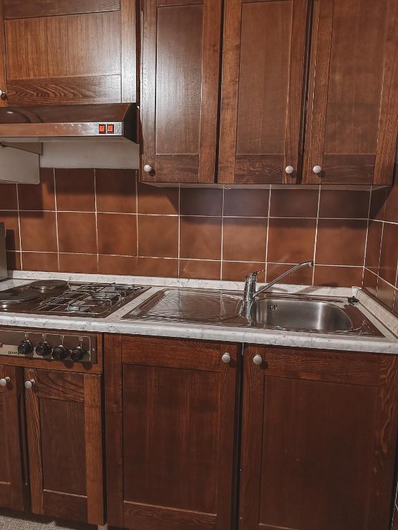 Kuchyň nebo kuchyňský kout v ubytování Apartment HM