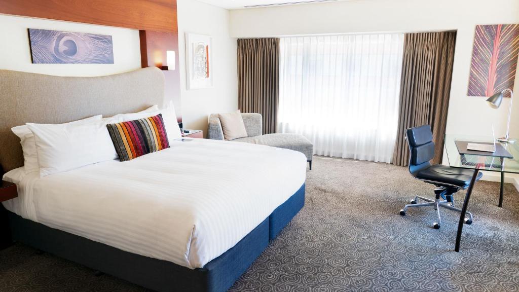 Postel nebo postele na pokoji v ubytování Crowne Plaza Auckland by IHG