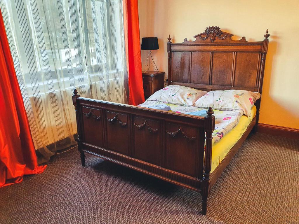 Postel nebo postele na pokoji v ubytování Apartamenty nad Wisłą Renesans