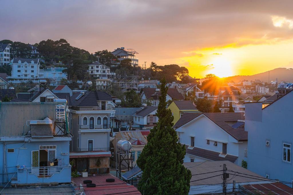 a view of a city at sunset at Vuon Xuan Hotel - STAY 24H in Da Lat