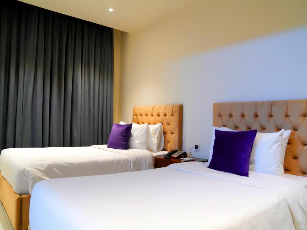 Indigo Heights Hotel & Suitesにあるベッド