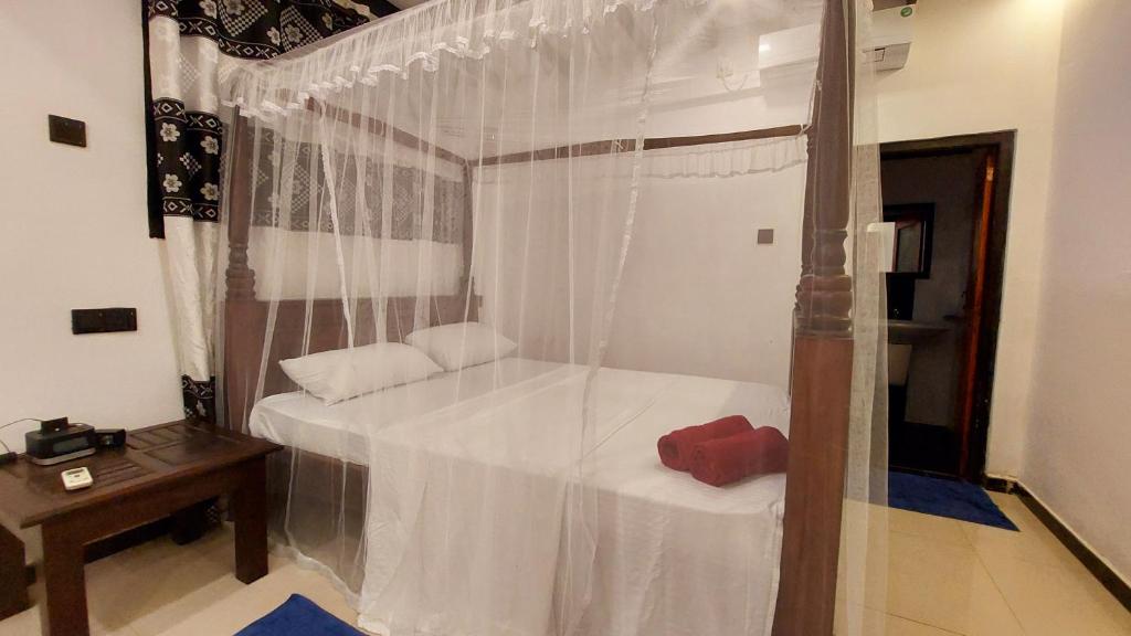 Letto o letti in una camera di Bandulas Beach House