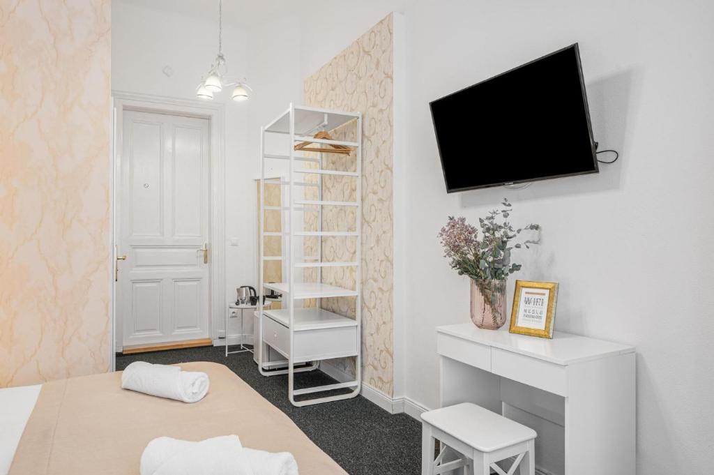 A television and/or entertainment centre at Downtown Bratislava B&B