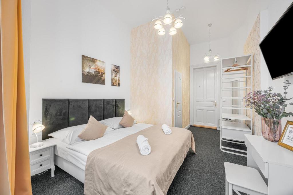 A bed or beds in a room at Downtown Bratislava B&B