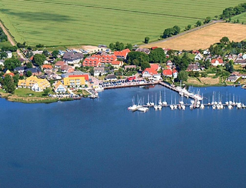 an aerial view of a harbor with boats in the water at Hotel- & Ferienanlage Kapitäns-Häuser Breege in Breege