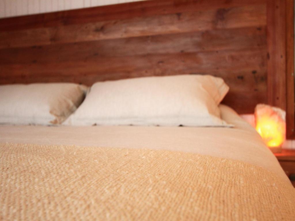 Postel nebo postele na pokoji v ubytování Cuarzo Lodge