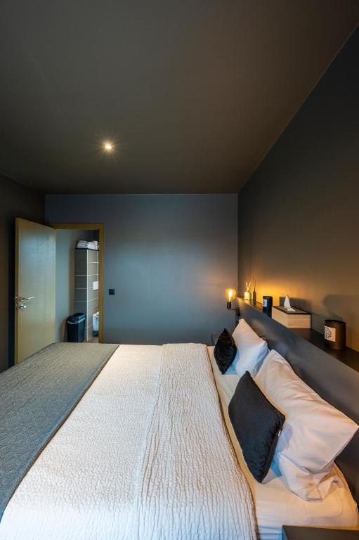 Postel nebo postele na pokoji v ubytování M-otel E40