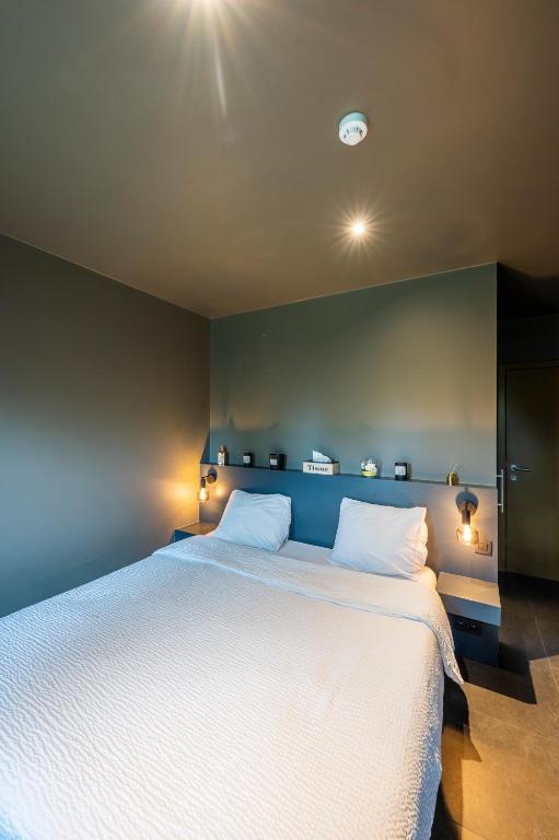 Postel nebo postele na pokoji v ubytování M-otel E40