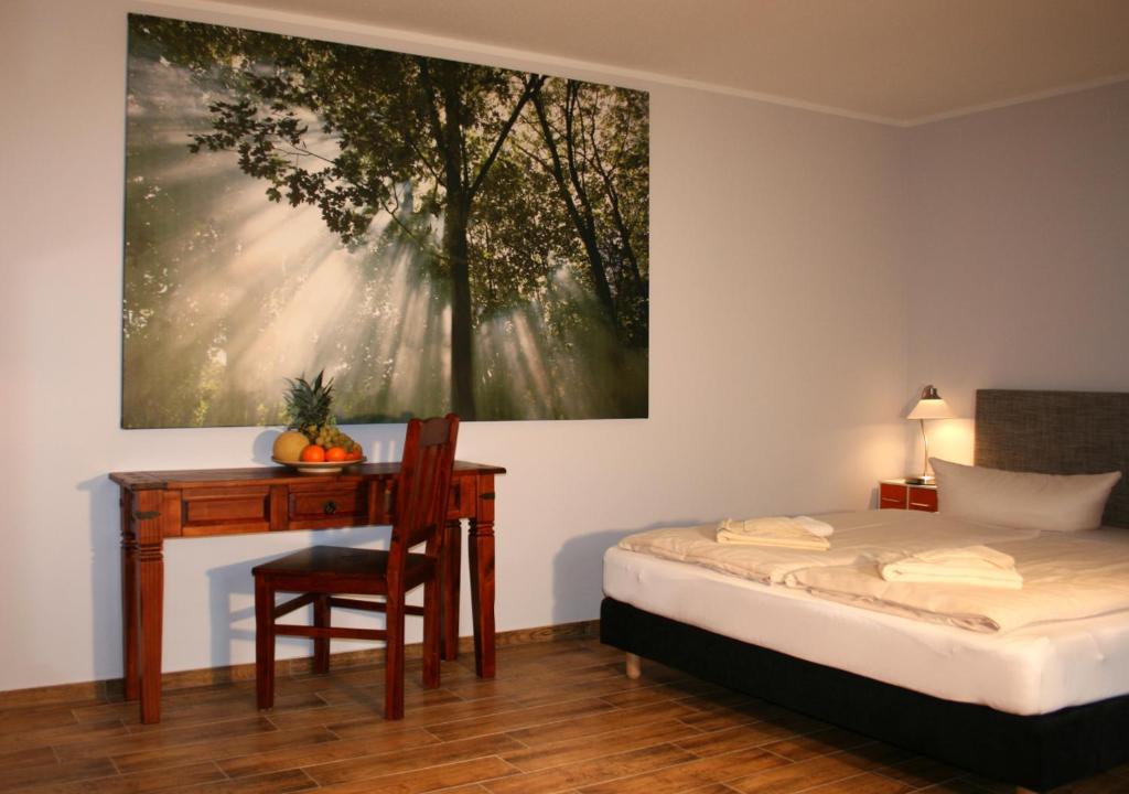 Postel nebo postele na pokoji v ubytování DAS HUDEWALD Hotel & Resort