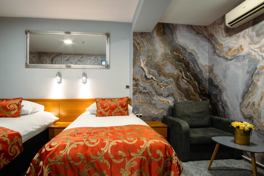 Postel nebo postele na pokoji v ubytování Hotel Villa Harmony - Free Parking