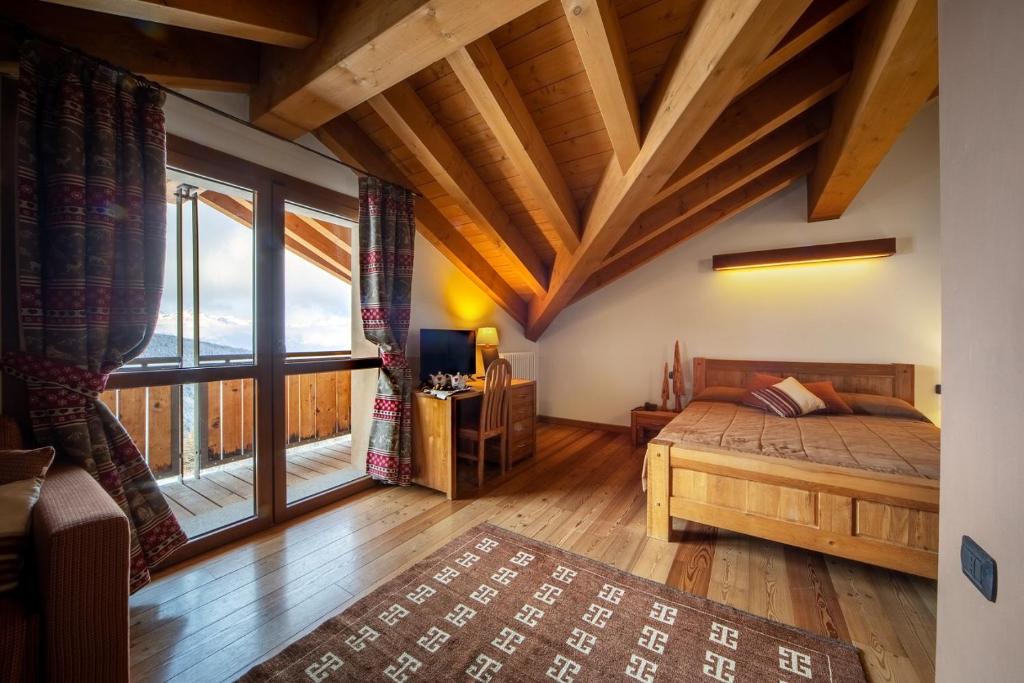 Łóżko lub łóżka w pokoju w obiekcie Hotel La Chance