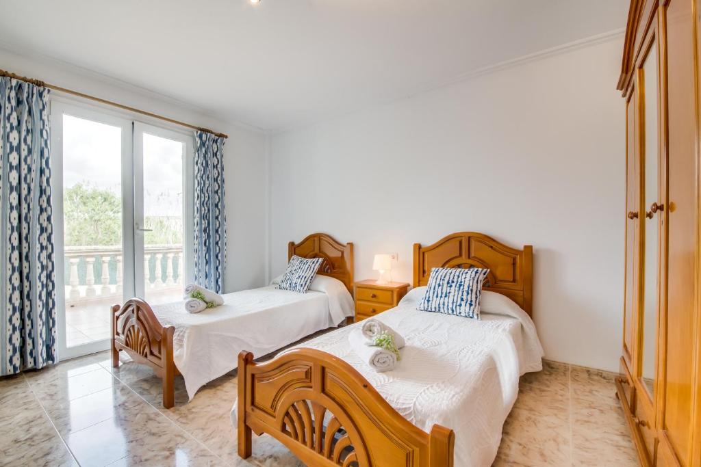 Postel nebo postele na pokoji v ubytování Ideal Property Mallorca - Villa Corb Mari
