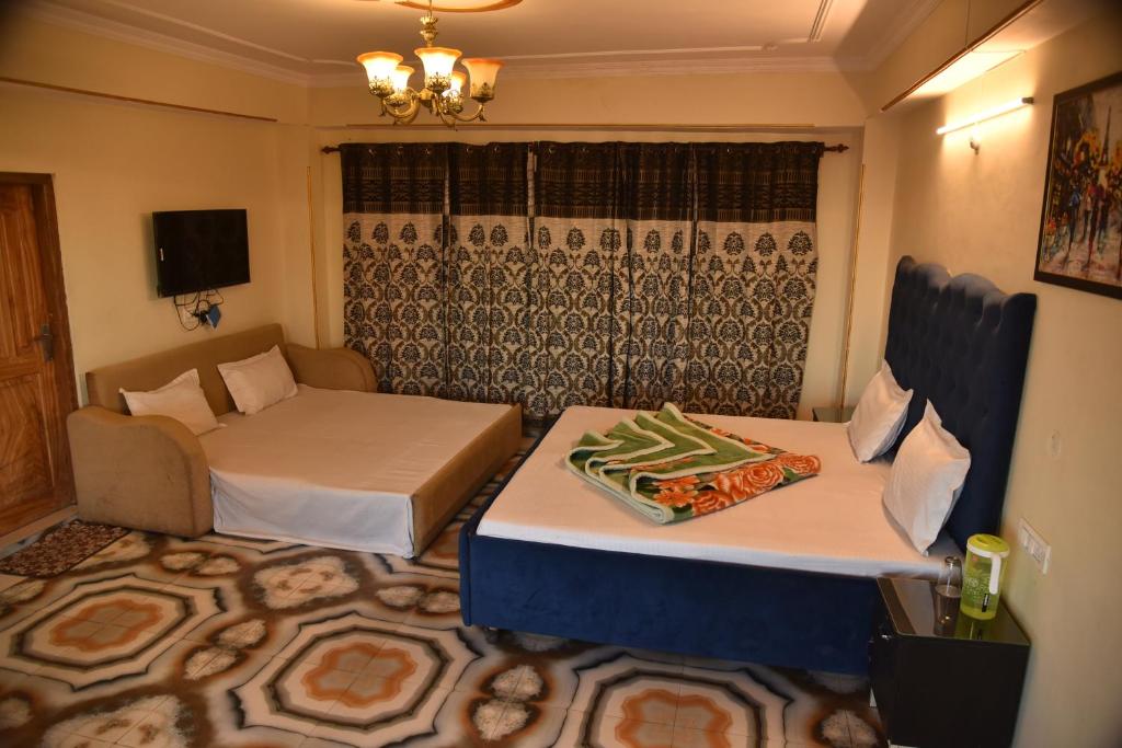Postel nebo postele na pokoji v ubytování Mashobra valley B&B