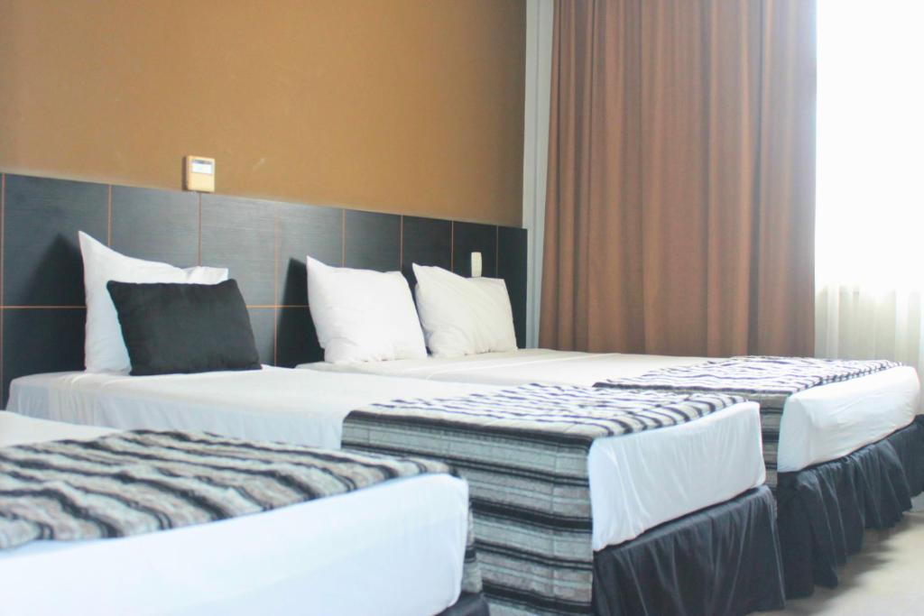 Postel nebo postele na pokoji v ubytování Hotel Atlântico Tower