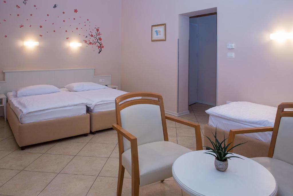 Postel nebo postele na pokoji v ubytování Hotel Kozana