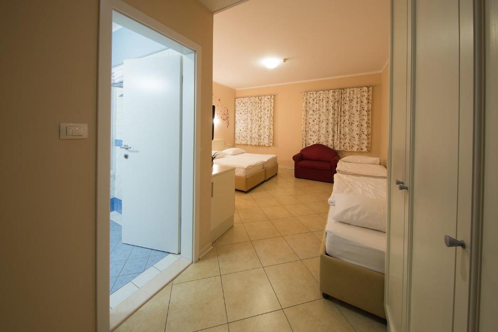 Postel nebo postele na pokoji v ubytování Hotel Kozana