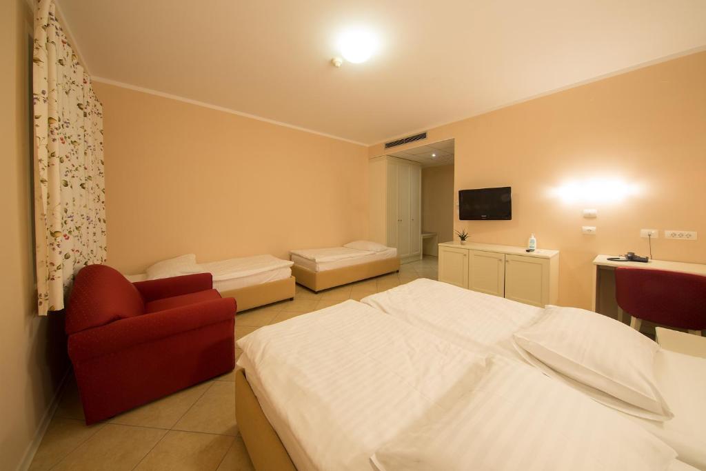 Postel nebo postele na pokoji v ubytování Hotel Kozana