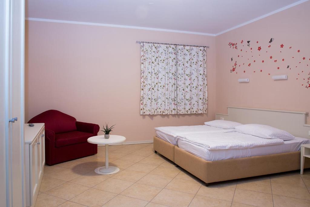Postel nebo postele na pokoji v ubytování Hotel Kozana
