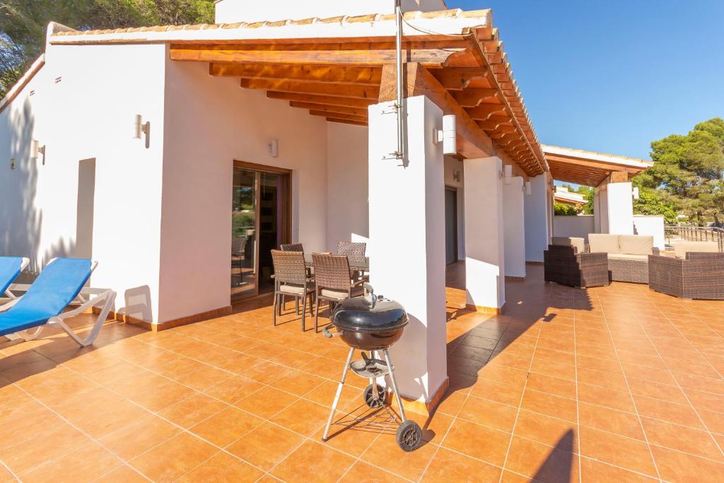 A patio or other outdoor area at Villa Ampolla II - Costa CarpeDiem